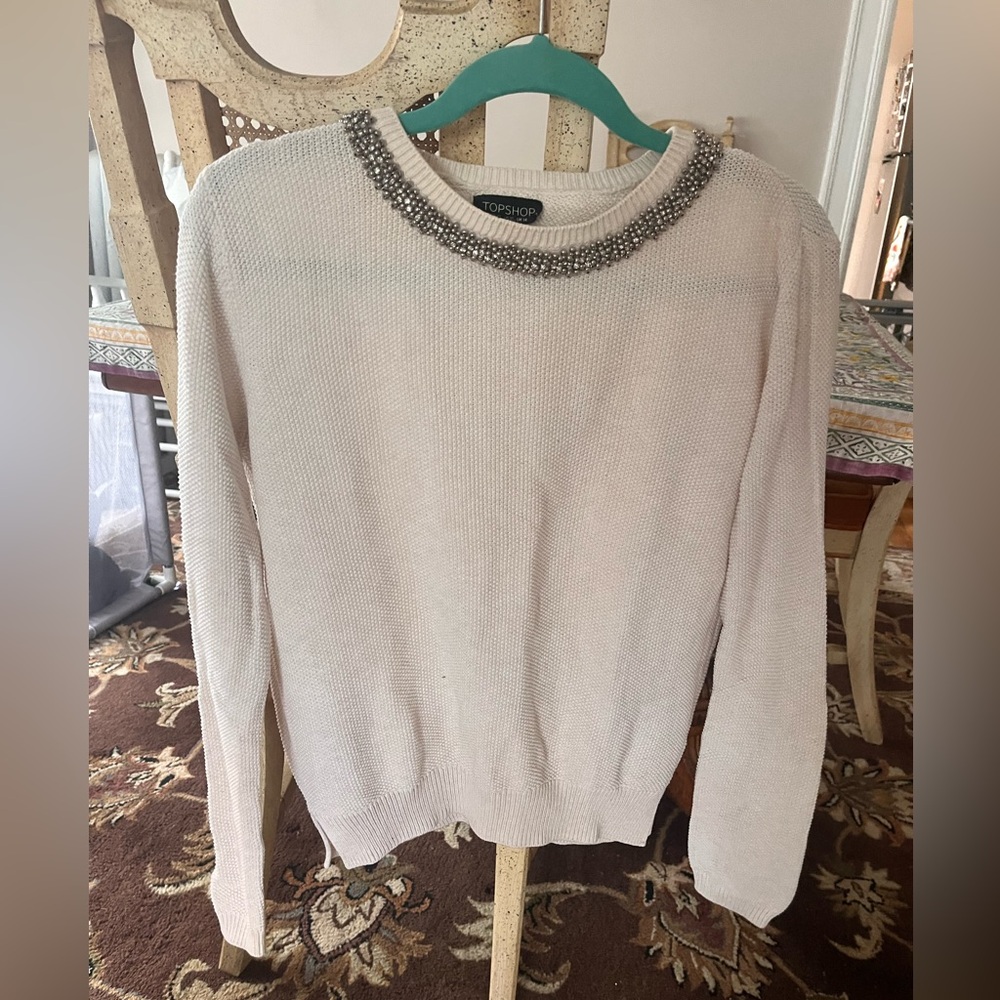 White sweater with beaded collar